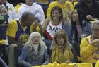 Dell Curry, left, and his wife, Sonya, center, the parents of Golden State Warriors guard Stephen Curry and Portland Trail Blazers guard Seth Curry, laugh next to Ayesha Curry during the first half of Game 1 of the NBA basketball playoffs Western Conference finals between the Warriors and the Trail Blazers in Oakland, Calif., Tuesday, May 14, 2019. Ayesha Curry is the wife of Stephen Curry. (AP Photo/Jeff Chiu)