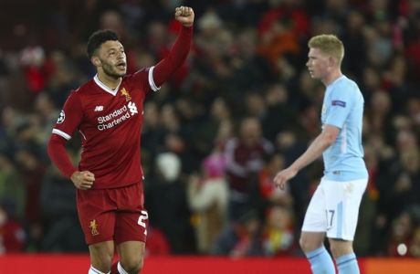 Liverpool's Alex Oxlade-Chamberlain, left, celebrates after he scores his side's second goal during the Champions League quarter final first leg soccer match between Liverpool and Manchester City at Anfield stadium in Liverpool, England, Wednesday, April 4, 2018. (AP Photo/Dave Thompson)