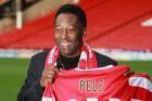 SHEFFIELD, UNITED KINGDOM - NOVEMBER 07:  Former Brazilian national footballer Pele poses with a Sheffield United number 10 football shirt at Bramhall Lane stadium on November 7, 2007 in Sheffield, England. Pele (full name Edson Arantes Do Nascimento) is in the UK to attend a ceremony marking the 150th anniversary of Sheffield United FC, the world's oldest football club, and it's new links with Brazilian club Sao Paulo FC. Pele will also be in attendance during the 150th anniversary match between Sheffield United and Inter Milan on November 8, 2007.  (Photo by Christopher Furlong/Getty Images)