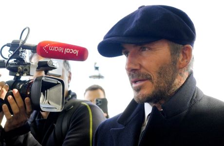 David Beckham speaks to the media after leaving Westminster Palace where he paid respects to the late Queen Elizabeth II, at Westminster Hall, London, England, Friday, Sept. 16, 2022. The Queen will lie in state in Westminster Hall for four full days before her funeral on Monday Sept. 19. (AP Photo/Markus Schreiber)