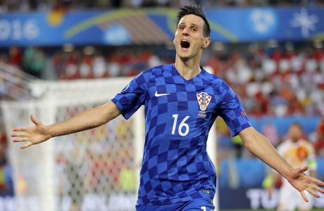 Croatia's Nikola Kalinic celebrates after scoring his sides first goal during the Euro 2016 Group D soccer match between Croatia and Spain at the Nouveau Stade in Bordeaux, France, Tuesday, June 21, 2016. (AP Photo/Manu Fernandez)