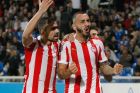 Olympiacos'Greek forward Konstantinos Mitroglou, right, reacts with Olympiacos'Greek defender Ioannis Maniatis, after scoring against Montpellier, during their Champions League Group B soccer match, at La Mosson stadium, in Montpellier, southern France,  Wednesday, Oct. 24, 2012. (AP Photo/Claude Paris)