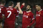 Liverpool's Mohamed Salah, 2nd right, celebrates with his teammates their side's third goal during the Champions League semifinal, first leg, soccer match between Liverpool and AS Roma at Anfield Stadium, Liverpool, England, Tuesday, April 24, 2018. (AP Photo/Dave Thompson)