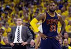 Cleveland Cavaliers forward LeBron James (23) stands on the court in front of head coach David Blatt during the first half of Game 2 of basketball's NBA Finals against the Golden State Warriors in Oakland, Calif., Sunday, June 7, 2015. (AP Photo/Ben Margot)