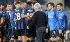 Atalanta players celebrate with their head coach Gian Piero Gasperini at the end of the Champions League Group F soccer match between Atalanta and Young Boys, at the Gewiss Stadium in Bergamo, Italy, Wednesday, Sept 29, 2021. Atalanta won 1-0. (AP Photo/Luca Bruno)