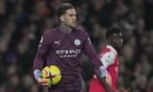 Manchester City's goalkeeper Ederson reacts during the English Premier League soccer match between Arsenal and Manchester City at the Emirates stadium in London, England, Wednesday, Feb.15, 2023. (AP Photo/Kin Cheung)