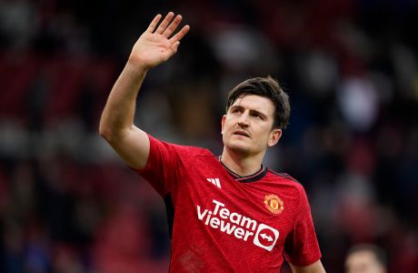 Manchester United's Harry Maguire gestures after the English Premier League soccer match between Manchester United and Liverpool at the Old Trafford stadium in Manchester, England, Sunday, April 7, 2024. (AP Photo/Dave Thompson)