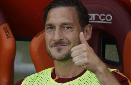 Roma's Francesco Totti gives the thumb up sign prior to an Italian Serie A soccer match between Roma and Genoa at the Olympic stadium in Rome, Sunday, May 28, 2017. Francesco Totti is playing his final match with Roma against Genoa after a 25-season career with his hometown club. (AP Photo/Alessandra Tarantino)