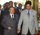 Algerian President Abdelaziz Bouteflika, left, holds hands with United Arab Emirates Sheik Mansour bin Zayed, son of Sheik Mohammed bin Zayed Al Nahyan, as they arrive at the Hotel Intercontinental in Geneva, Switzerland, Saturday, July 27, 2002. Bouteflika is in Switzerland for a private meeting with Sheik Mohammed bin Zayed Al Nahyanon, for talks about ways to revive Mideast peacemaking. (AP Photo/KEYSTONE/Laurent Gillieron)