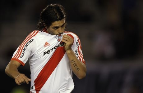River Plate's Alejandro Dominguez celebrates after scoring before being adjudged offside during an Argentina's second division league soccer match against Chacarita in Buenos Aires, Argentina, Tuesday, Aug. 16, 2011. Historic soccer team River Plate was relegated to the second division for the first time in its 110-year existence last June. The goal was annulled.  (AP Photo/Natacha Pisarenko)