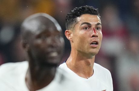 Portugal's Cristiano Ronaldo plays with a nose injury during the UEFA Nations League soccer match between the Czech Republic and Portugal at the Sinobo stadium in Prague, Czech Republic, Saturday, Sept. 24, 2022. (AP Photo/Petr David Josek)