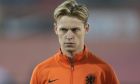Netherlands' Frenkie de Jong lines up prior to the World Cup 2022 group G qualifying soccer match between the Netherlands and Norway at De Kuip stadium in Rotterdam, Netherlands, Tuesday, Nov. 16, 2021. (AP Photo/Peter Dejong)