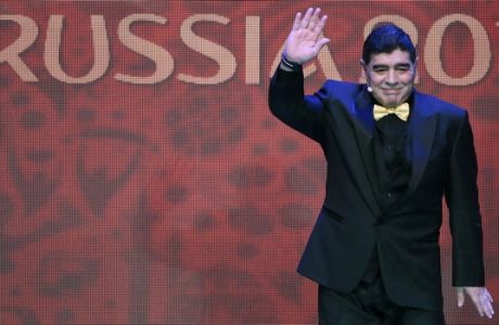 Argentine soccer legend Diego Maradona waves as he arrives at the 2018 soccer World Cup draw in the Kremlin in Moscow, Friday, Dec. 1, 2017. (AP Photo/Ivan Sekretarev)