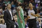 Boston Celtics head coach Brad Stevens, left, and Kyrie Irving, center, look at a video board with an official during the first half of an NBA basketball game against the Charlotte Hornets in Charlotte, N.C., Monday, Nov. 19, 2018. (AP Photo/Chuck Burton)