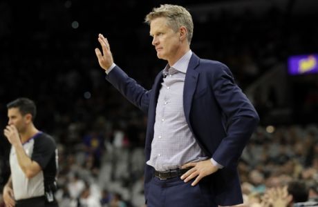Golden State Warriors head coach Steve Kerr signals to his team in the second half of Game 3 of a first-round NBA basketball playoff series against the San Antonio Spurs in San Antonio, Thursday, April 19, 2018. Golden State won 110-97. (AP Photo/Eric Gay)