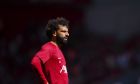 Liverpool's Mohamed Salah warms up before the English Premier League soccer match between Liverpool and Aston Villa at Anfield stadium in Liverpool, Sunday, Sept 3, 2023. (AP Photo/Jon Super)