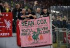 Fans hold a banner in English and Italian in support of Liverpool fan Sean Cox during the Champions League semifinal second leg soccer match between Roma and Liverpool at the Olympic Stadium in Rome, Wednesday, May 2, 2018. Cox has been in an induced coma since being attacked before the first leg match in Liverpool. (AP Photo/Alessandra Tarantino)