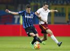 Inter Milans Stevan Jovetic, left, challenges for the ball with Romas Kostantinos Manolas during the Serie A soccer match between Inter Milan and AS Roma at the San Siro stadium in Milan, Italy, Saturday, Oct. 31, 2015. (AP Photo/Antonio Calanni)