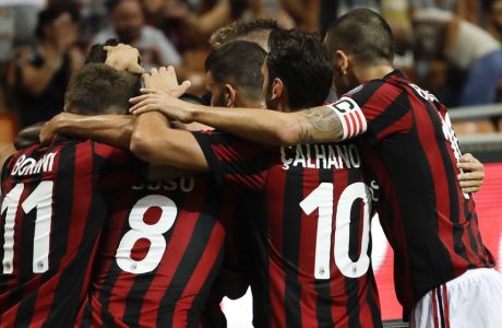 AC Milan players celebrate after Patrick Cutrone scored during a Serie A soccer match between AC Milan and Cagliari, at the San Siro stadium in Milan, Italy, Sunday, Aug. 27, 2017. (AP Photo/Luca Bruno)