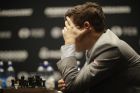 Reigning chess world champion Magnus Carlsen, from Norway, plays Italian-American challenger Fabiano Caruana, not pictured, in the first five minutes of round three of their World Chess Championship Match in London, Monday, Nov. 12, 2018. Their World Chess Championship Match began on Friday in London. (AP Photo/Matt Dunham)