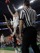 Virginia's Kyle Guy (5) takes a shot as Auburn's Samir Doughty (10) was called foul during the second half in the semifinals of the Final Four NCAA college basketball tournament, Saturday, April 6, 2019, in Minneapolis. (AP Photo/David J. Phillip)