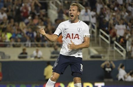 IMAGE DISTRIBUTED FOR INTERNATIONAL CHAMPIONS CUP - Tottenham's Harry Kane pumps his fist and leaps into the air as he celebrates his goal against Paris Saint-Germain's goalie Alphonse Areola, left, second half of the on Saturday, July 22, 2017, in Orlando, Fla. (Phelan Ebenhack/AP Images for International Champions Cup)