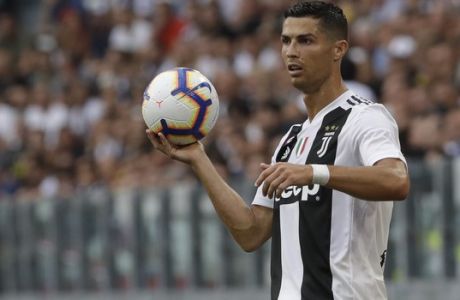 Juventus' Cristiano Ronaldo takes a throw in during the Serie A soccer match between Juventus and Lazio at the Allianz Stadium in Turin, Italy, Saturday, Aug. 25, 2018. (AP Photo/Luca Bruno)