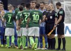 Referee Bibiana Steinhaus, 2nd right, shakes hand with players prior to the German Bundesliga soccer match between Hertha BSC Berlin and SV Werder Bremen in Berlin, Germany, Sunday, Sept. 10, 2017. (AP Photo/Michael Sohn)