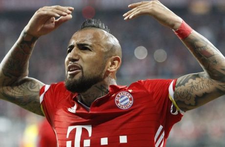 Bayern's Arturo Vidal celebrates after scoring his sides opening goal during the Champions League quarterfinal first leg soccer match between FC Bayern Munich and Real Madrid, in Munich, Germany, Wednesday, April 12, 2017. (AP Photo/Thomas Schmidtutz)
 