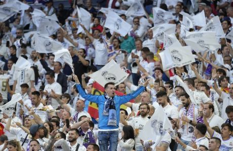 Real Madrid fans cheer ahead of the Champions League final soccer match between Liverpool and Real Madrid at the Stade de France in Saint Denis near Paris, Saturday, May 28, 2022. (AP Photo/Kirsty Wigglesworth)