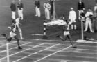 Jesse Owens of the U.S. wins his third gold medal as he crosses the finish line in the 200 meter dash at a time of 20.7 seconds at the Olympic Games in Berlin, Germany, Aug. 14, 1936. America's Mack Robinson, left, was second and Tinus Osendarp, center, of the Netherlands came in third. (AP Photo)
