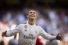 FILE - This is a  Sunday, April 5, 2015 file photo of Real Madrid's Cristiano Ronaldo as he celebrates after scoring a goal during a La Liga soccer match between Real Madrid and Granada at the Santiago Bernabeu stadium in Madrid. The 2015 Ballon dOr award is on Monday Jan. 11, 2016 in Zurich. Ronaldo has won it three times including the past two years but Messi is strongly favored to be named FIFA best player for a fifth time.  Messis Barcelona teammate Neymar is the other candidate.  (AP Photo/Daniel Ochoa de Olza, File)