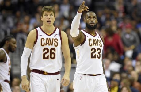 Cleveland Cavaliers forward LeBron James (23) points next to guard Kyle Korver (26) during the second half of an NBA basketball game, Friday, Nov. 3, 2017, in Washington. The Cavaliers won 130-122.(AP Photo/Nick Wass)
