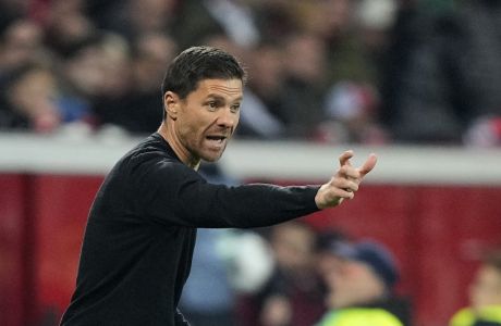 Leverkusen's head coach Xabi Alonso gives instructions to his players during the Champions League Group B soccer match between Bayer Leverkusen and Porto in Leverkusen, Germany, Wednesday, Oct. 12, 2022. (AP Photo/Martin Meissner)