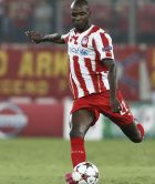 Olympiacos Eric Abidal shoots the ball during a Champions League Group A soccer match between Olympiakos and Atletico Madrid at Georgios Karaiskakis Stadium in the port of Piraeus near Athens, Tuesday, Sept. 16, 2014. (AP Photo/Petros Giannakouris) 