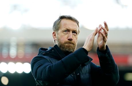 Brighton's head coach Graham Potter applauds at the end of the English Premier League soccer match between Liverpool and Brighton and Hove Albion at Anfield Stadium, Liverpool, England, Saturday, Oct. 30, 2021. (AP Photo/Jon Super)
