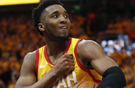 Utah Jazz guard Donovan Mitchell (45) reacts as he walks off the court the end of the first half during an NBA basketball game against the Houston Rockets Saturday, April 20, 2019, in Salt Lake City. (AP Photo/Rick Bowmer)
