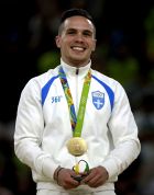Greece's Eleftherios Petrounias, gold medallist, stands on the podium during the medal ceremony for the artistic gymnastics men's rings final at the 2016 Summer Olympics in Rio de Janeiro, Brazil, Monday, Aug. 15, 2016. (AP Photo/Julio Cortez)