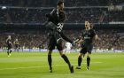 PSG's Adrien Rabiot, center celebrates after scoring the opening goal with his teammate Neymar, left, during the Champions League soccer match, round of 16, 1st leg between Real Madrid and Paris Saint Germain at the Santiago Bernabeu stadium in Madrid, Spain, Wednesday, Feb. 14, 2018. (AP Photo/Paul White)