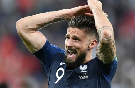 France's Olivier Giroud celebrates after his team advanced to the final after the semifinal match between France and Belgium at the 2018 soccer World Cup in the St. Petersburg Stadium in St. Petersburg, Russia, Tuesday, July 10, 2018. (AP Photo/Martin Meissner)