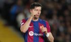 Barcelona's Robert Lewandowski reacts after a missed scoring opportunity during the Champions League quarterfinal second leg soccer match between Barcelona and Paris Saint-Germain at the Olimpic Lluis Companys stadium in Barcelona, Spain, Tuesday, April 16, 2024. (AP Photo/Emilio Morenatti)