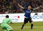 Inter Milan's Mauro Icardi, right, celebrates after Inter Milan's Andrea Barzagli scoring his side's second goal during the Serie A soccer match between Inter Milan and Juventus at the San Siro stadium in Milan, Italy, Saturday, April 28, 2018. (AP Photo/Antonio Calanni)