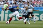 France's Antoine Griezmann, left, and Argentina's Javier Mascherano challenge for the ball during the round of 16 match between France and Argentina, at the 2018 soccer World Cup at the Kazan Arena in Kazan, Russia, Saturday, June 30, 2018. (AP Photo/David Vincent)