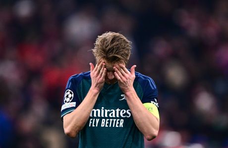 Arsenal's Martin Odegaard reacts disappointed after the Champions League quarter final second leg soccer match between Bayern Munich and Arsenal at the Allianz Arena in Munich, Germany, Wednesday, April 17, 2024. (AP Photo/Christian Bruna)