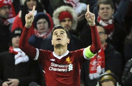 Liverpool's Philippe Coutinho celebrates after scoring his side's opening goal during the Champions League Group E soccer match between Liverpool and Spartak Moscow at Anfield, Liverpool, England, Wednesday, Dec. 6, 2017. (AP Photo/Rui Vieira)