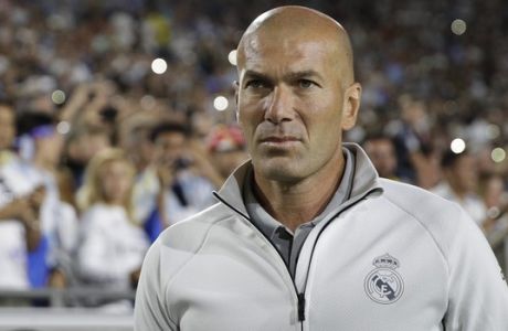 Real Madrid manager Zinedine Zidane walks across the field before the team's International Champions Cup soccer match against the Manchester City Wednesday, July 26, 2017, in Los Angeles. (AP Photo/Jae C. Hong)