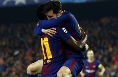 Barcelona's Ousmane Dembele, left, celebrates with Lionel Messi after scoring his side's second goal during the Champions League round of sixteen second leg soccer match between FC Barcelona and Chelsea at the Camp Nou stadium in Barcelona, Spain, Wednesday, March 14, 2018. (AP Photo/Manu Fernandez)