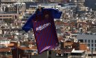 A drone flies over the Sagrada Familia Basilica with the new Barcelona soccer team jersey for the upcoming 2018/2019 season, during it's presentation in Barcelona, Spain, Saturday, May 19, 2018. (AP Photo/Manu Fernandez)