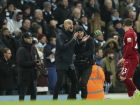 Manchester City's manager Pep Guardiola, centre applauds his players during their English Premier League soccer match between Manchester City and Liverpool at the Ethiad stadium, Manchester England, Thursday, Jan. 3, 2019. (AP Photo/Jon Super)