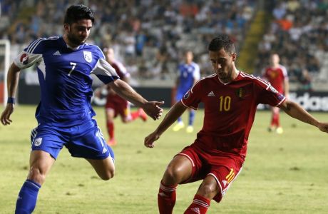 Belgium's Eden Hazard (R) dribbles the ball as Cyprus' Georgios Economides defends during their EURO 2016 qualifying football match between Cyprus and Belgium at the Neo GSP stadium in the Cypriot capital, Nicosia, on September 6, 2015. AFP PHOTO / FLORIAN CHOBLET        (Photo credit should read FLORIAN CHOBLET/AFP/Getty Images)